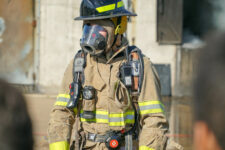 firefighter wearing full turnout gear and mask