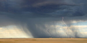 tornado clouds and a streak of lightning touching the ground
