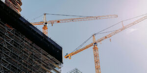 yellow crane near building during day time