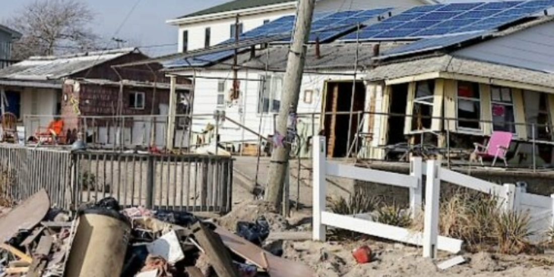 A community of homes with wreckage after a disaster