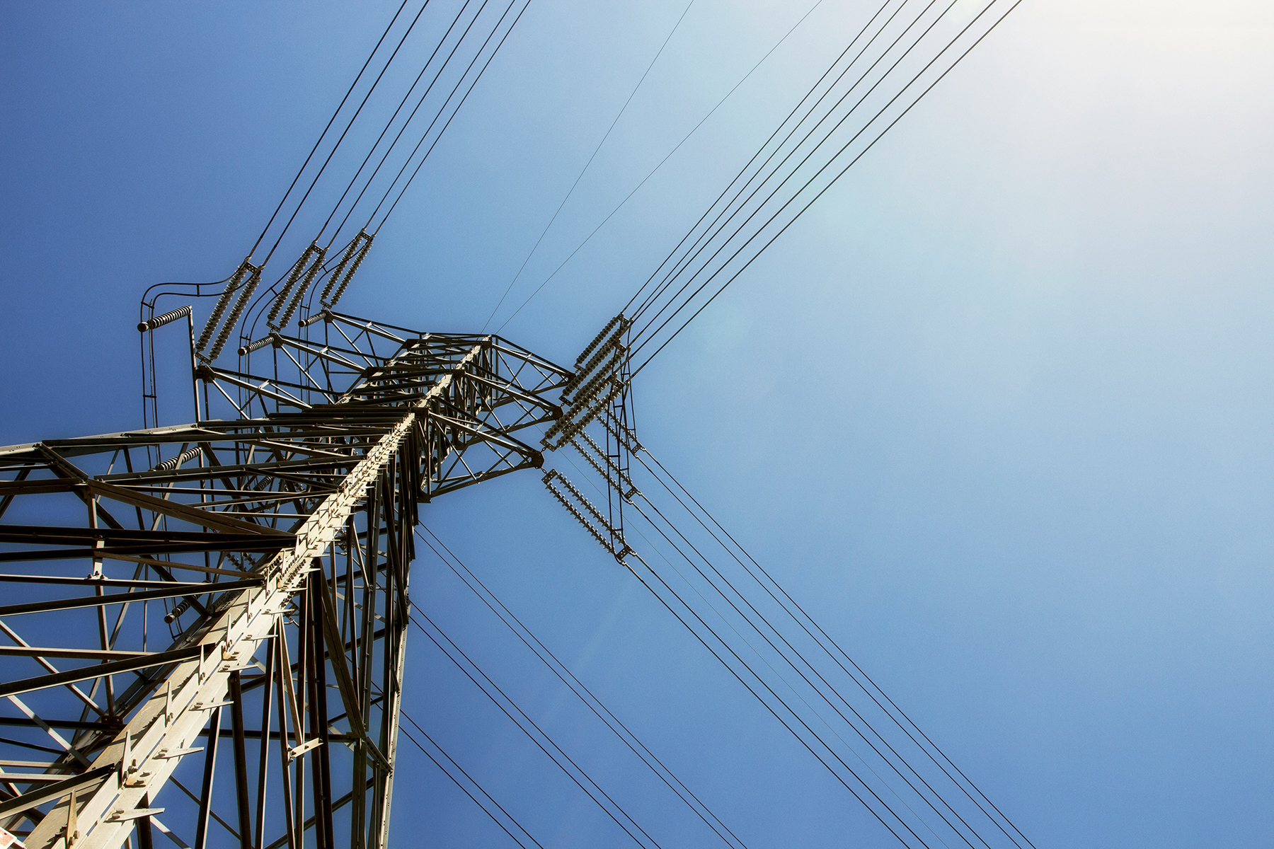 Power lines against a blue sky