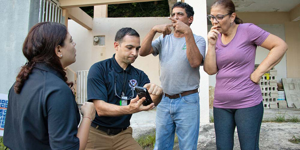 A group of language interpreters, including a sign language interpreter