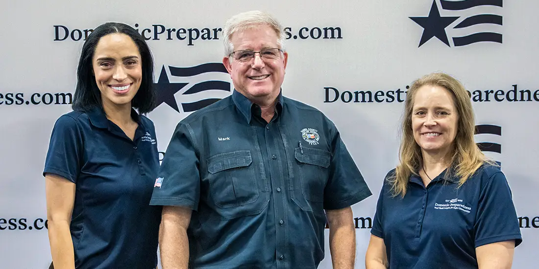 Group photo of Nicolette Phillips, Mark Sloan, and Catherine Feinman standing against a white background with Domestic Preparedness logo.