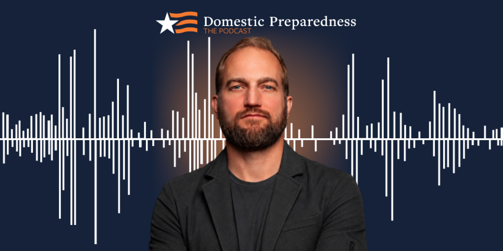 Domestic Preparedness: The Podcast logo above a headshot of Justin Snair with a sound bar image in the background.